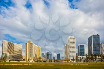 TEL AVIV, ISRAEL - JANUARY 1, 2016: Skyscrapers on Tel Aviv's seafront. Windy and bright winter day at the seaside