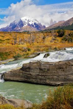 Picturesque waterfall Cascades Paine. National Park Torres del Paine in southern Chile