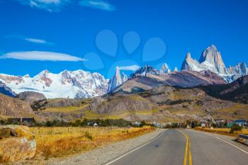 Sunny day in February in Argentine Patagonia. The beautiful concrete highway to the majestic mountain Fiz Roy