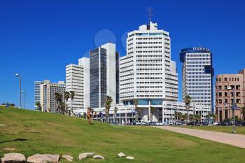 TEL AVIV, ISRAEL - MAY 2, 2014: Modern magnificent hotels skyscrapers and green lawns. The picturesque Tel Aviv promenade in sunny spring day