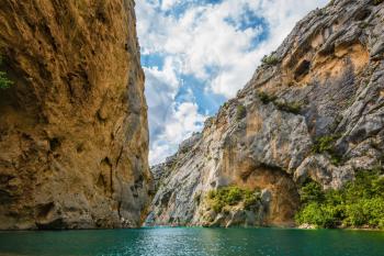 Mercantour National Park, Provence. The rocky slopes of canyon Verdon descend into azure water of the river