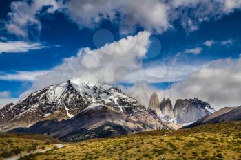 Mountains and rocks in Torres del Paine National Park. Summer in the south of Chile. The concept of car extreme tourism