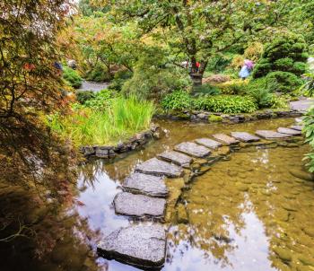  The track of the stones in the Japanese part of the garden. Amazingly beautiful decorative private garden in western Canada Butchart Gardens