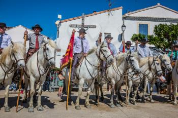 Sent-Mari-de-la-Mer, Provence, France - May 25, 2015.  Square in the center of the city. World Festival of Gypsies. Escorts - security guards on white horses before the parade