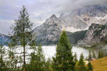 Dense fog in a mountain valley in the Austrian Alps