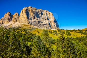  The famous picturesque Sella Pass in the Dolomites. Windy sunny autumn day. Travel to South Tyrol. The concept of extreme and ecological tourism