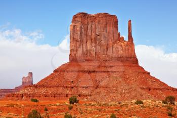 Magical landscape Monument Valley in Arizona. Magnificent cliffs - mitts of red sandstone. In the sky a rainbow shines