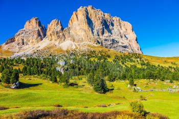  Travel to South Tirol. The picturesque Sella Pass in the Dolomites. Windy sunny day.  The concept of extreme and ecological tourism