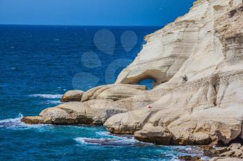 Rocks of white limestone form arches and grottoes on the shores of the Mediterranean Sea. The grottoes of Rosh Ha Nikra. Geological phenomenon in the north of Israel