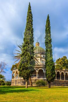 Catholic monastery and a small church Mount Beatitudes. Dome and colonnade surrounded by cypress. Israel, the shores of Lake Kinneret