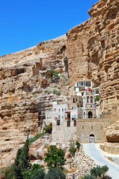The famous Orthodox monastery of St. George Cozeba. The building of the monastery was built on the wall of the gorge of Wadi Kelt near Jerusalem. The main entrance
