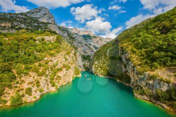 National park Merkantur, Provence, France. White catamarans and motor boats are sailing with tourists on turquoise water of the river Verdon