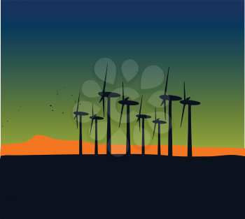 windmill silhouettes on sunset landscape