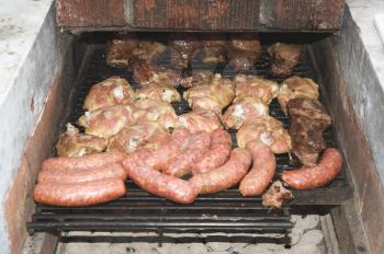Royalty Free Photo of a Barbecue With a Variety of Meats
