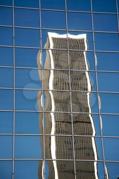 Royalty Free Photo of a Skyscraper Reflected in Another Skyscraper