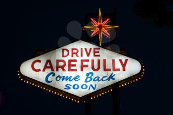 Royalty Free Photo of the Drive Carefully Sign in Las Vegas at Night