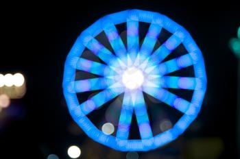 Royalty Free Photo of an Out of Focus Blue Ferris Wheel