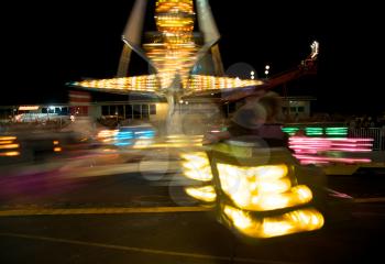Royalty Free Photo of an Amusement Park at Night That's Blurry
