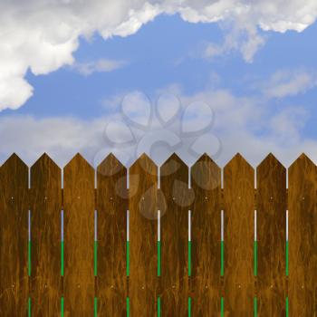 Wooden fence and green grass on blue sky