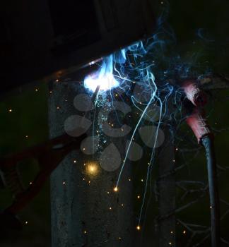 Worker using electric welding machine