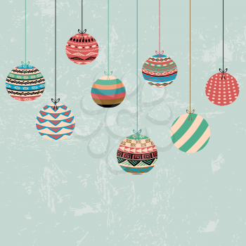 Christmas greeting card with decoration balls hanging on ribbon