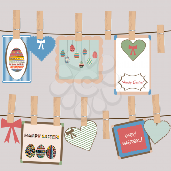 Vintage Easter frames and decorations hanging on a rope in cloth pegs