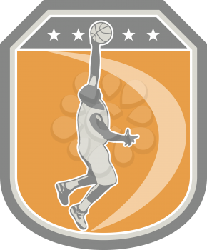 Illustration of a basketball player dunking rebounding ball set inside shield crest with stars done in retro style on isolated background.