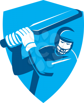 Illustration of a cricket player batsman with bat batting set inside shield crest done in retro style on isolated background.