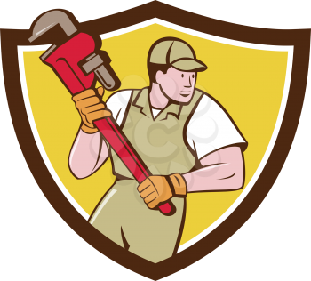 Illustration of a plumber holding giant pipe wrench looking to the side viewed from front set inside shield crest on isolated background done in cartoon style. 