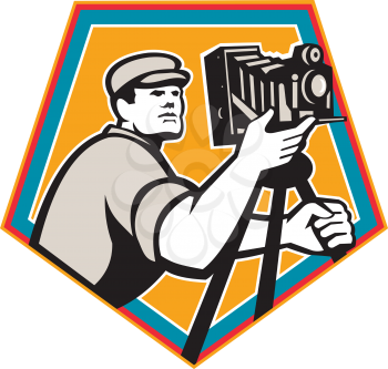 Illustration of a cameraman movie director with vintage movie film camera viewed from low angle set inside shield crest on isolated background done in retro style.