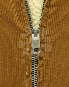 Royalty Free Photo of a Half Open Zipper on Corduroy