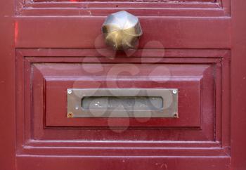 Royalty Free Photo of a Doorknob and Letter Slot
