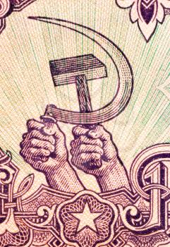 Royalty Free Photo of Hands holding hammer and sickle on 5 Leva 1951 Banknote from Bulgaria