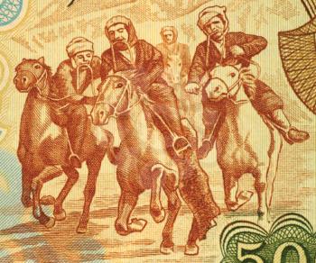 Royalty Free Photo of Horsemen Competing at Buzkashi on 500 Afgani 1979 Banknote from Afghanistan.