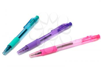 A set of transparent colored pens on a white background, isolated.