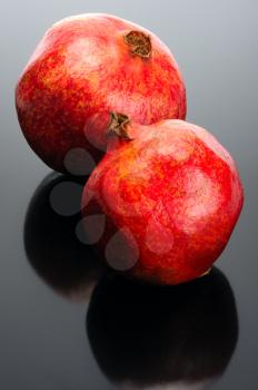 Royalty Free Photo of Two Pomegranates on Black