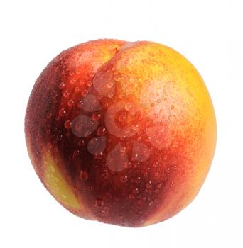 Ripe nectarine with water drops on a white background, isolated.