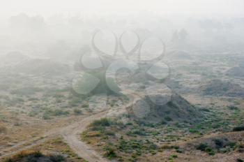 Royalty Free Photo of a Fog Over a Barren Landscape