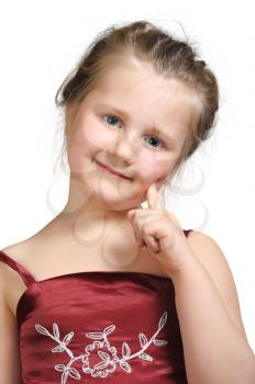 Royalty Free Photo of a Little Girl in a Red Dress With Her Finger at Her Cheek