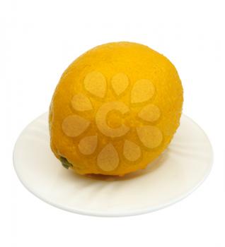 Lemon on a white plate on a white background, isolated