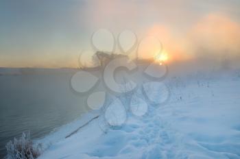 Royalty Free Photo of a Winter Scene at Sunrise
