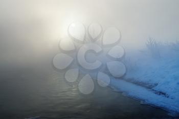 Royalty Free Photo of a Fog Over Water in Winter