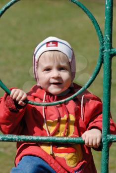 Royalty Free Photo of a Child Playing in a Park