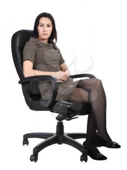 Girl in brown dress sitting in an office chair, isolated on a white background.