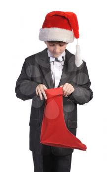 Boy with red hat and red sock, isolated on a white background.