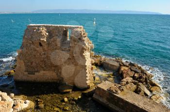 Remains of fortress walls of the Acre and the Mediterranean Sea