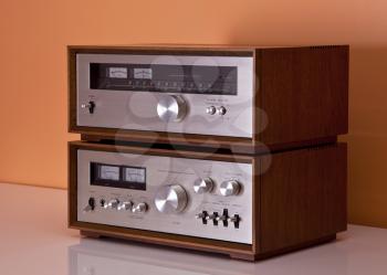 Royalty Free Photo of an Amplifier and Tuner in Wooden Cabinets