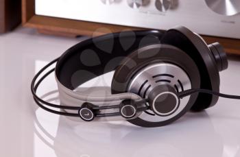 Royalty Free Photo of Headphones Connected to a Stereo