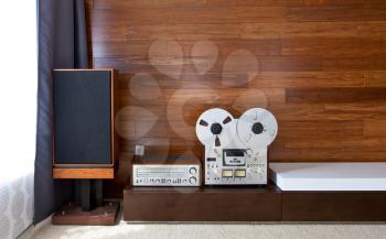 Vintage audio system in minimalistic modern interior, frontal view