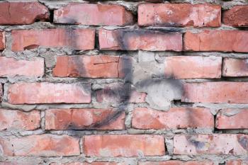 old brick wall with nazi swastika